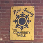 Image of a sign on a brick wall