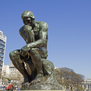 Image of a statue of a man in deep thought